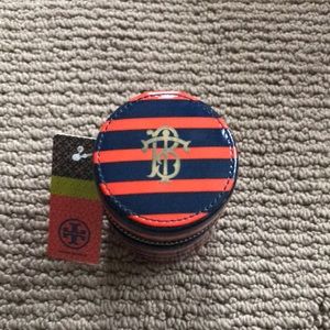 Tory Burch travel adapter never used.